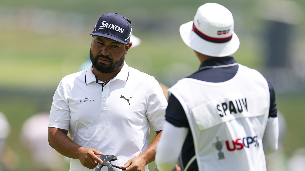 OAKMONT, PENNSYLVANIA - JUNE 12: J.J. Spaun of the United States and his caddie meet on the ninth green after finishing their round during the first round of the 125th U.S. OPEN at Oakmont Country Club on June 12, 2025 in Oakmont, Pennsylvania.