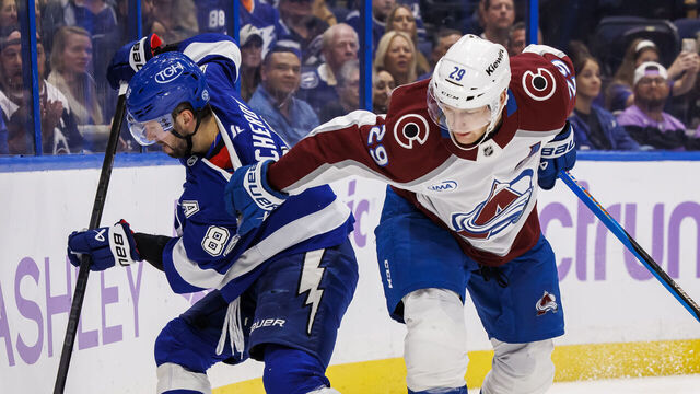 TAMPA, FL - NOVEMBER 25: Nikita Kucherov #86 of the Tampa Bay Lightning battles against Nathan MacKinnon #29 of the Colorado Avalanche at Amalie Arena on November 25, 2024 in Tampa, Florida.