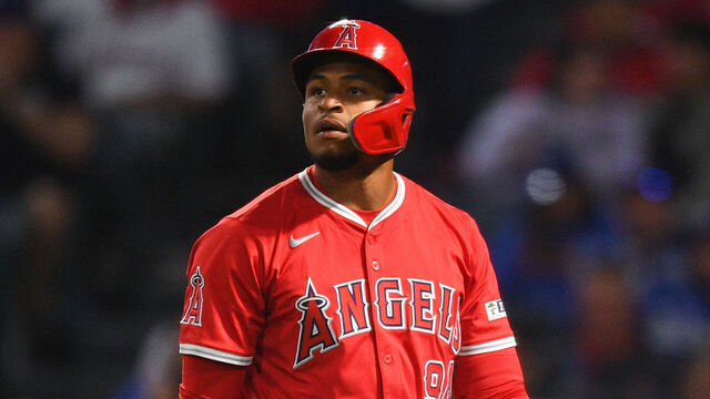 ANAHEIM, CA - MARCH 25: Los Angeles Angels second baseman Christian Moore (94) walks back to the dugout after striking out during the MLB Spring Training game between the Los Angeles Dodgers and the Los Angeles Angels on March 25, 2025 at Angel Stadium of Anaheim in Anaheim, CA.