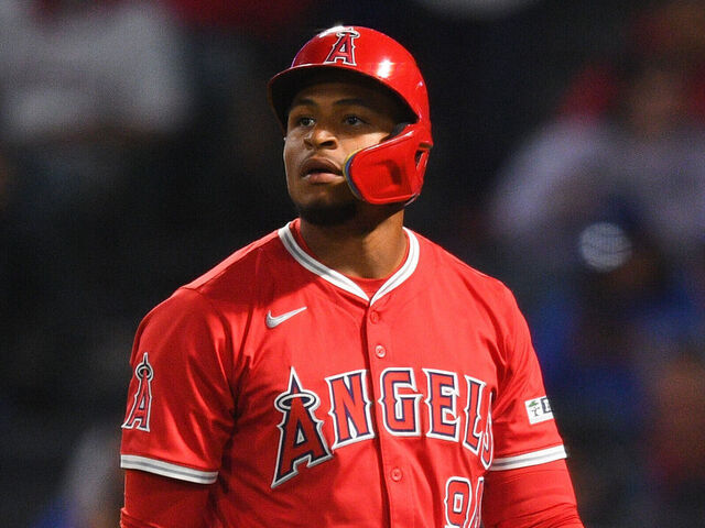 ANAHEIM, CA - MARCH 25: Los Angeles Angels second baseman Christian Moore (94) walks back to the dugout after striking out during the MLB Spring Training game between the Los Angeles Dodgers and the Los Angeles Angels on March 25, 2025 at Angel Stadium of Anaheim in Anaheim, CA.