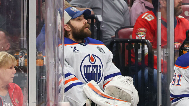 SUNRISE, FLORIDA - JUNE 12: Stuart Skinner #74 of the Edmonton Oilers sits on the bench after a goalie change during the second period against the Edmonton Oilers in Game Four of the 2025 Stanley Cup Final at Amerant Bank Arena on June 12, 2025 in Sunrise, Florida.