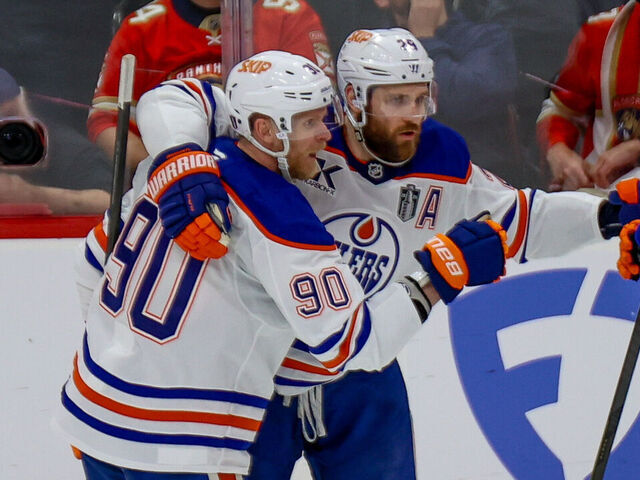 SUNRISE, FL - JUNE 09: Edmonton Oilers Right Wing Corey Perry (90) celebrates his goal with Edmonton Oilers Center Leon Draisaitl (29) and Edmonton Oilers Defenseman Evan Bouchard (2) during the Stanley Cup Final game three between the Edmonton Oilers and the Florida Panthers on June 9, 2025 at Amerant Bank Arena in Sunrise, Fla.