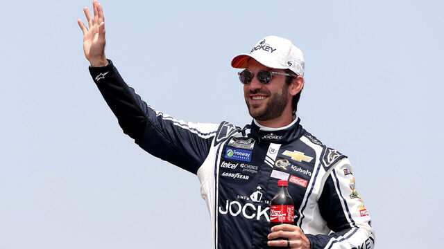 BROOKLYN, MICHIGAN - JUNE 08: Daniel Suarez, driver of the #99 Jockey Infinite Cool Underwear Chevrolet, waves to fans as he walks onstage during driver intros prior to the NASCAR Cup Series FireKeepers Casino 400 at Michigan International Speedway on June 08, 2025 in Brooklyn, Michigan.