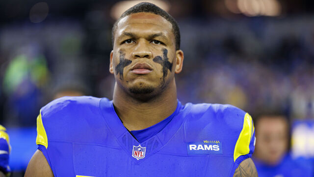 INGLEWOOD, CALIFORNIA - DECEMBER 28: Offensive tackle Alaric Jackson #77 of the Los Angeles Rams stands on the sidelines during the national anthem prior to an NFL football game against the Arizona Cardinals, at SoFi Stadium on December 28, 2024 in Inglewood, California.
