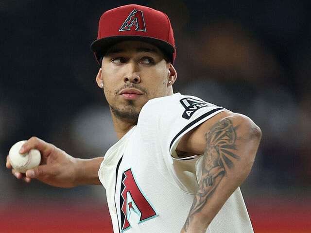 PHOENIX, ARIZONA - JUNE 09: Relief pitcher Justin Martinez #63 of the Arizona Diamondbacks pitches against the Seattle Mariners during the ninth inning of the MLB game at Chase Field on June 09, 2025 in Phoenix, Arizona. The Diamondbacks defeated the Mariners 8-4 in 11 innings.