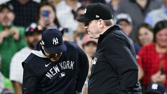 BOSTON, MASSACHUSETTS - JUNE 13: New York Yankees manager Aaron Boone gets ejected in the tenth inning against the Boston Red Sox at Fenway Park on June 13, 2025 in Boston, Massachusetts.