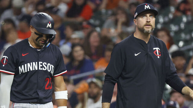 HOUSTON, TX - JUNE 13: Minnesota Twins third baseman Royce Lewis (23) leaves the field with Minnesota Twins manager Rocco Baldelli (5) in the top of the ninth inning during the MLB game between the Minnesota Twins and Houston Astros on June 13, 2025 at Daikin Park in Houston, Texas.