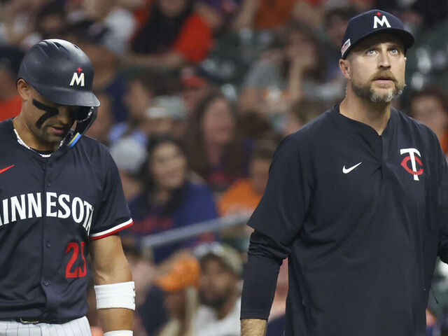 HOUSTON, TX - JUNE 13: Minnesota Twins third baseman Royce Lewis (23) leaves the field with Minnesota Twins manager Rocco Baldelli (5) in the top of the ninth inning during the MLB game between the Minnesota Twins and Houston Astros on June 13, 2025 at Daikin Park in Houston, Texas.