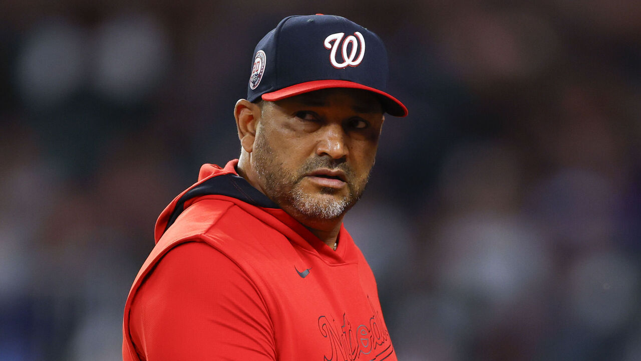 ATLANTA, GEORGIA - MAY 12: Manager Dave Martinez of the Washington Nationals makes a pitching change during the seventh inning against the Atlanta Braves at Truist Park on May 12, 2025 in Atlanta, Georgia.