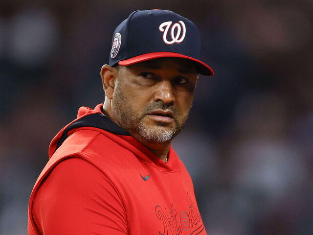 ATLANTA, GEORGIA - MAY 12: Manager Dave Martinez of the Washington Nationals makes a pitching change during the seventh inning against the Atlanta Braves at Truist Park on May 12, 2025 in Atlanta, Georgia.