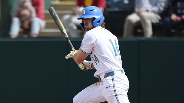 LOS ANGELES, CALIFORNIA - MARCH 24: A.J. Salgado #14 of the UCLA Bruins runs for first base after a hit during a game against the USC Trojans at Jackie Robinson Stadium on March 24, 2024 in Los Angeles, California.