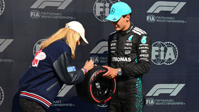 MONTREAL, QUEBEC - JUNE 14: Summer McIntosh presents Pole position qualifier George Russell of Great Britain and Mercedes AMG Petronas F1 Team with his Pirelli Pole Position award during qualifying ahead of the F1 Grand Prix of Canada at Circuit Gilles-Villeneuve on June 14, 2025 in Montreal, Quebec.