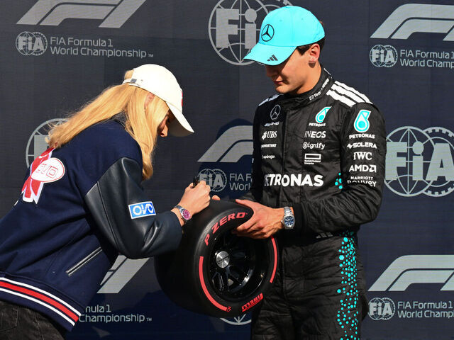 MONTREAL, QUEBEC - JUNE 14: Summer McIntosh presents Pole position qualifier George Russell of Great Britain and Mercedes AMG Petronas F1 Team with his Pirelli Pole Position award during qualifying ahead of the F1 Grand Prix of Canada at Circuit Gilles-Villeneuve on June 14, 2025 in Montreal, Quebec.