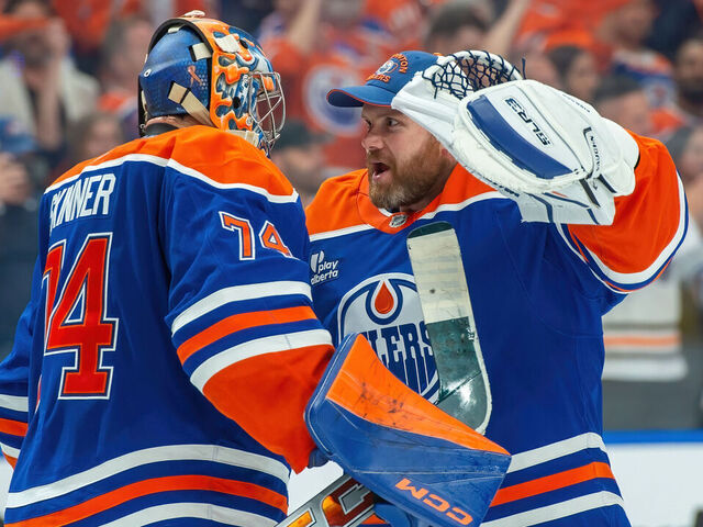 EDMONTON, CANADA - MAY 27: Stuart Skinner #74 and Calvin Pickard #30 of the Edmonton Oilers celebrate a victory over the Dallas Stars after Game Four of the Western Conference Finals of the 2025 Stanley Cup Playoffs at Rogers Place on May 27, 2025, in Edmonton, Alberta, Canada.