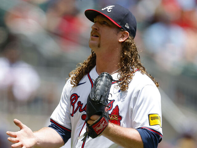 ATLANTA, GEORGIA - JUNE 15: Grant Holmes #66 of the Atlanta Braves reacts during the second inning against the Colorado Rockies at Truist Park on June 15, 2025 in Atlanta, Georgia.