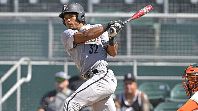 CORAL GABLES, FL - APRIL 21: Louisville catcher Zion Rose (32) bats in the fifth inning as the Miami Hurricanes faced the Louisville Cardinals on April 21, 2024, at Mark Light Field at Alex Rodriguez Park in Coral Gables, Florida.