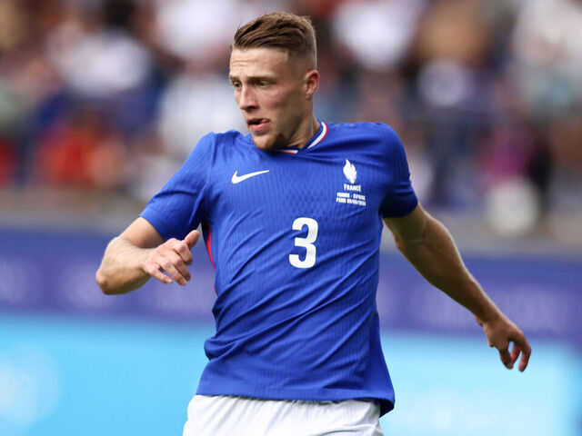 PARIS, FRANCE - AUGUST 09: Adrien Truffert of Team France runs with a ball during the Men's Gold Medal match between France and Spain during the Olympic Games Paris 2024 at Parc des Princes on August 09, 2024 in Paris, France.