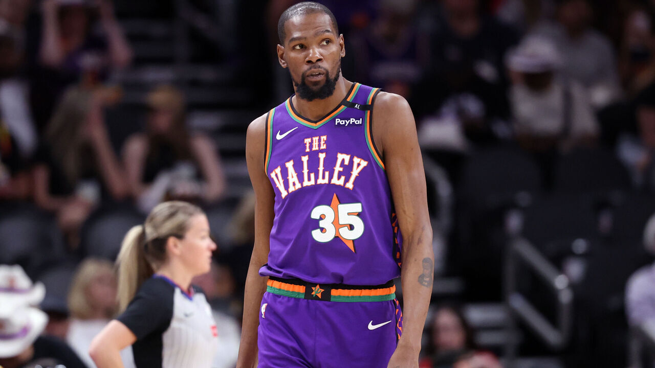 PHOENIX, ARIZONA - MARCH 30: Kevin Durant #35 of the Phoenix Suns looks on during the second half against the Houston Rockets at PHX Arena on March 30, 2025 in Phoenix, Arizona. The Rockets defeated the Suns 148-109.
