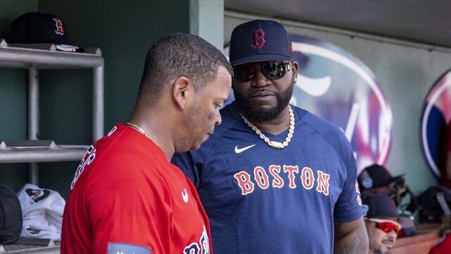 FT. MYERS, FL - MARCH 4: Rafael Devers #11 of the Boston Red Sox talks with former designated hitter David Ortiz during the second inning of a Spring Training Grapefruit League game against the Houston Astros on March 4, 2023 at JetBluePark at Fenway South in Fort Myers, Florida.