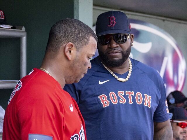 FT. MYERS, FL - MARCH 4: Rafael Devers #11 of the Boston Red Sox talks with former designated hitter David Ortiz during the second inning of a Spring Training Grapefruit League game against the Houston Astros on March 4, 2023 at JetBluePark at Fenway South in Fort Myers, Florida.