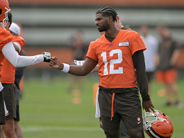BEREA, OHIO - JUNE 12: Quarterbacks Kenny Pickett #8 and Shedeur Sanders #12 of the Cleveland Browns celebrate during organized team activities at CrossCountry Mortgage Campus on June 12, 2025 in Berea, Ohio.