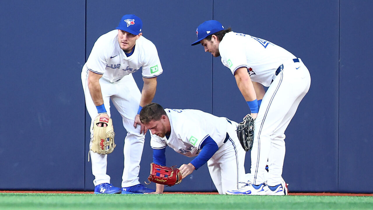 TORONTO, ON - JUNE 17: Will Robertson (L) #39 and Addison Barger (R) #47 of the Toronto Blue Jays look on after Myles Straw #3 crashed into the wall trying to make a catch in the fifth inning during a game against the Arizona Diamondbacks at Rogers Centre on June 17, 2025 in Toronto, Canada.