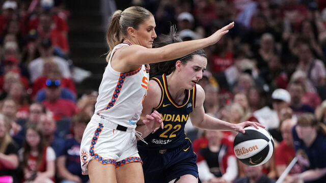 INDIANAPOLIS, INDIANA - JUNE 17: Caitlin Clark #22 of the Indiana Fever dribbles the ball while being guarded by Jacy Sheldon #4 of the Connecticut Sun in the second quarter at Gainbridge Fieldhouse on June 17, 2025 in Indianapolis, Indiana.