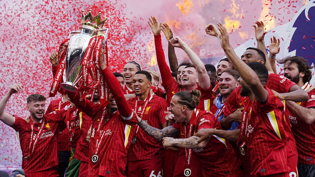 Liverpool's Virgil van Dijk lifts the Premier League trophy with team-mates after the Premier League match at Anfield, Liverpool. Picture date: Sunday May 25, 2025.