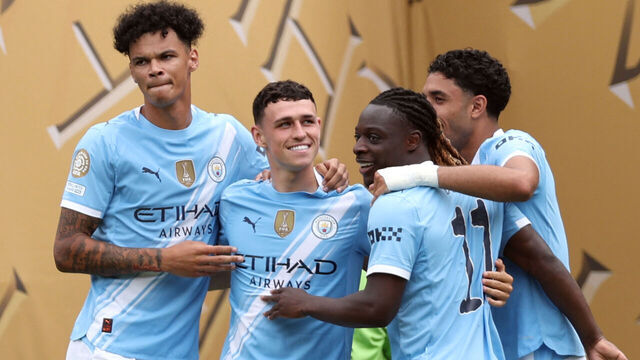 Manchester City's English midfielder #47 Phil Foden (2ndL) is congratulated by teammates after scoring the opening goal during the FIFA Club World Cup 2025 Group G football match between England's Manchester City and Morocco's Wydad AC at the Lincoln Financial Field stadium in Philadelphia on June 18, 2025.