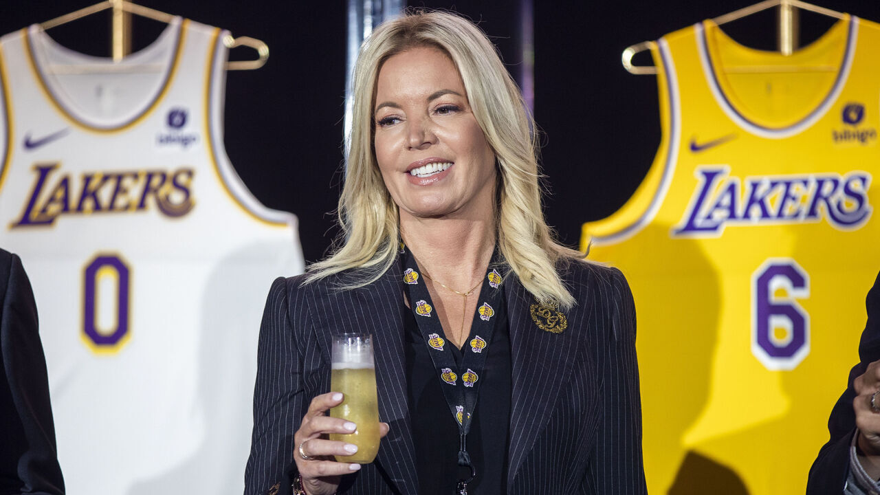 EL SEGUNDO, CA - September 20: Jeanie Buss, CEO / Governor / Co-owner of the Los Angeles Lakers, holds a new Lakers jersey as the Lakers host a 2021-2022 season kick-off event to unveil and announce a new global marketing partnership with Bibigo, which will appear on the Lakers jersey at the UCLA Health Training Center in El Segundo on Monday, Sept. 20, 2021. (Allen J. Schaben / Los Angeles Times via Getty Images)
