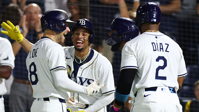 TAMPA, FLORIDA - JUNE 18: Brandon Lowe #8 of the Tampa Bay Rays celebrates with Christopher Morel #24, Junior Caminero #13 and Yandy Díaz #2 after hitting a two-run home run in the fifth inning against the Baltimore Orioles at George M. Steinbrenner Field on June 18, 2025 in Tampa, Florida.