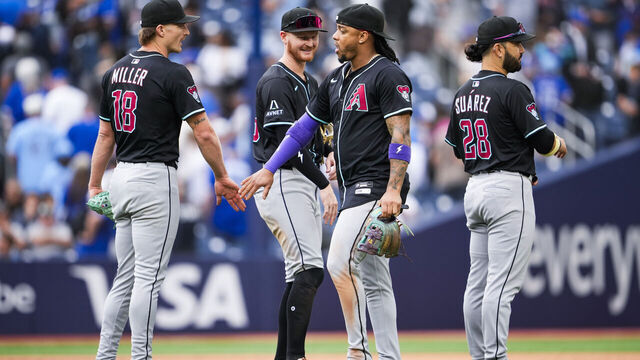 TORONTO, ON - JUNE 19: Shelby Miller #18, Pavin Smith #26, Ketel Marte #4, and Eugenio Suarez #28 of the Arizona Diamondbacks celebrate defeating the Toronto Blue Jays in their MLB game at the Rogers Centre on June 19, 2025 in Toronto, Ontario, Canada.