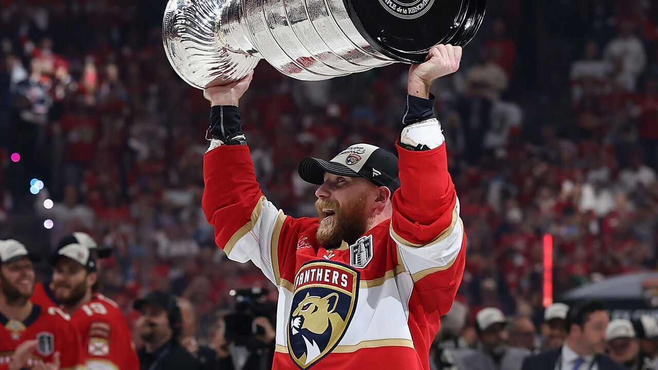 SUNRISE, FLORIDA - JUNE 17: Sam Bennett #9 of the Florida Panthers celebrates with the Stanley Cup after winning in Game Six of the 2025 Stanley Cup Finals at Amerant Bank Arena on June 17, 2025 in Sunrise, Florida. The Panthers defeated the Oilers 5-1 to win the Stanley Cup Finals.