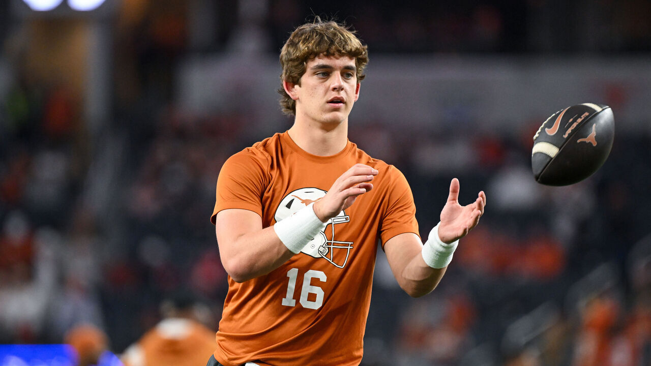 ARLINGTON, TEXAS - JANUARY 10: Arch Manning #16 of the Texas Longhorns warms up before the Goodyear Cotton Bowl at AT&T Stadium on January 10, 2025 in Arlington, Texas.