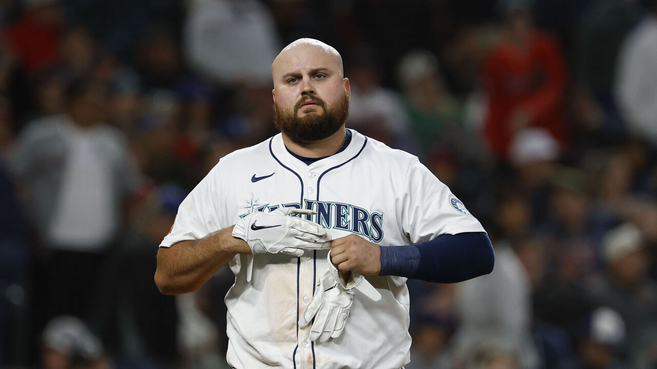 SEATTLE, WASHINGTON - JUNE 14: Rowdy Tellez #23 of the Seattle Mariners removes his batting gloves during the game against the Cleveland Guardians at T-Mobile Park on June 14, 2025 in Seattle, Washington. The Seattle Mariners win 4-3.