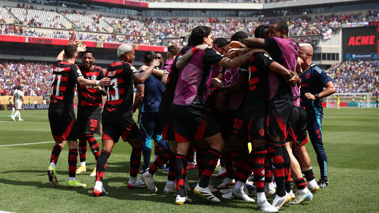 Flamengo's Brazilian forward #27 Bruno Henrique (unseen) celebrates with a teammates after scoring his team's first goal during the FIFA Club World Cup 2025 Group D football match between Brazil's CR Flamengo and England's Chelsea at the Lincoln Financial Field stadium in Philadelphia on June 20, 2025.