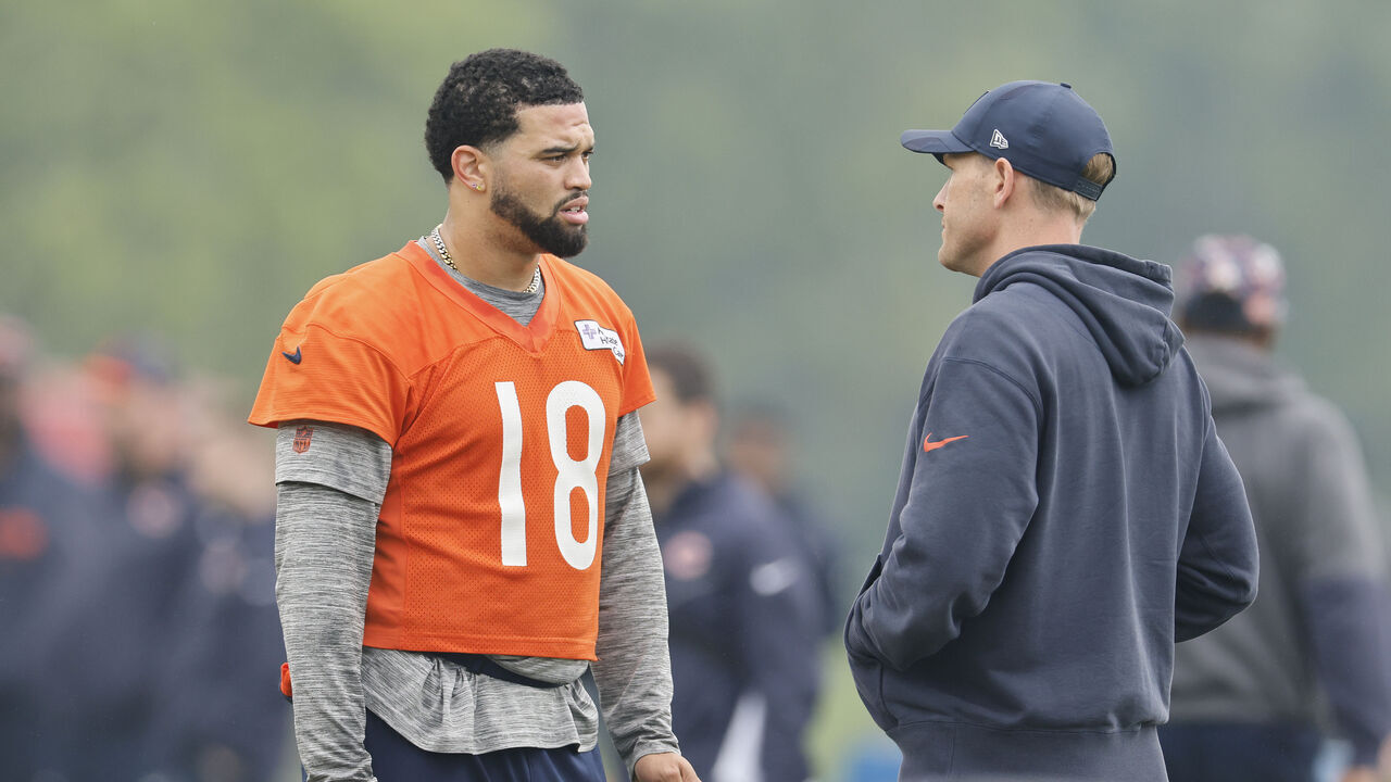 LAKE FOREST, ILLINOIS - JUNE 04: Caleb Williams #18 of the Chicago Bears talks with head coach Ben Johnson during Chicago Bears OTA Offseason Workout at Halas Hall on June 04, 2025 in Lake Forest, Illinois.