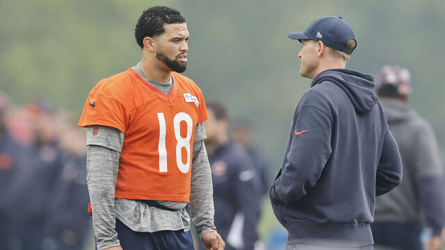 LAKE FOREST, ILLINOIS - JUNE 04: Caleb Williams #18 of the Chicago Bears talks with head coach Ben Johnson during Chicago Bears OTA Offseason Workout at Halas Hall on June 04, 2025 in Lake Forest, Illinois.