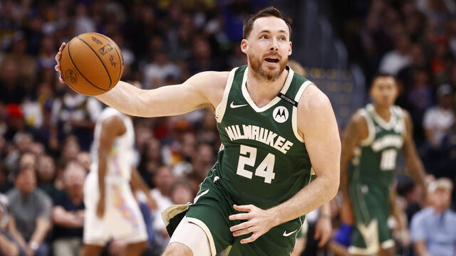 DENVER, COLORADO - MARCH 26: Pat Connaughton #24 of the Milwaukee Bucks handles the ball during the first quarter against the Denver Nuggets at Ball Arena on March 26, 2025 in Denver, Colorado.