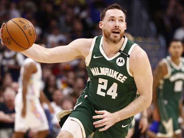 DENVER, COLORADO - MARCH 26: Pat Connaughton #24 of the Milwaukee Bucks handles the ball during the first quarter against the Denver Nuggets at Ball Arena on March 26, 2025 in Denver, Colorado.