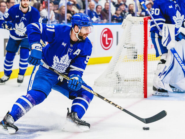 TORONTO, ON - May 18: Toronto Maple Leafs center John Tavares (91) is seen with the puck during the first period of game 7 of the Eastern Conference Playoffs between the Florida Panthers and Toronto Maple Leafs on May 18, 2025, at Scotiabank Arena in Toronto, ON.