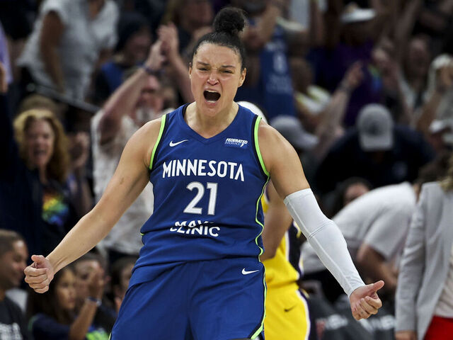 MINNEAPOLIS, MINNESOTA - JUNE 21: Kayla McBride #21 of the Minnesota Lynx celebrates after scoring a three-point shot during the fourth quarter against the Los Angeles Sparks at Target Center on June 21, 2025 in Minneapolis, Minnesota.