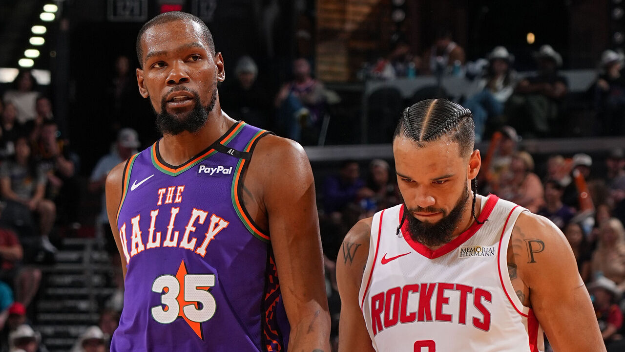 PHOENIX, AZ - MARCH 30: Kevin Durant #35 of the Phoenix Suns and Dillon Brooks #9 of the Houston Rockets looks on during the game on March 30, 2025 at PHX Arena in Phoenix, Arizona. Mandatory Copyright Notice: Copyright 2025 NBAE