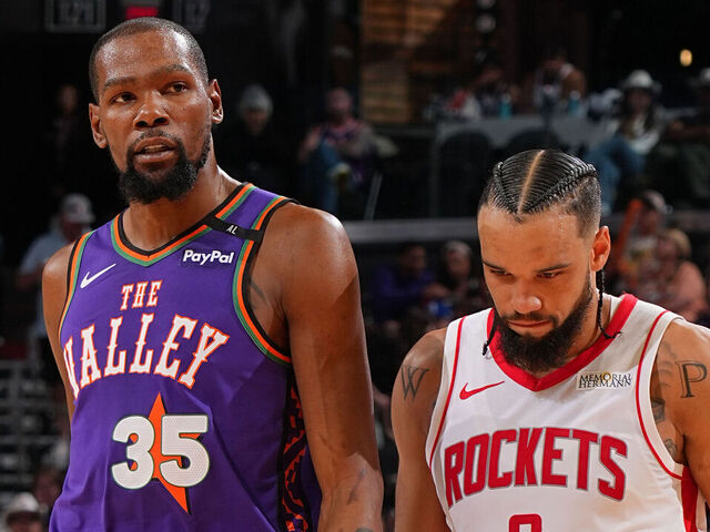 PHOENIX, AZ - MARCH 30: Kevin Durant #35 of the Phoenix Suns and Dillon Brooks #9 of the Houston Rockets looks on during the game on March 30, 2025 at PHX Arena in Phoenix, Arizona. Mandatory Copyright Notice: Copyright 2025 NBAE