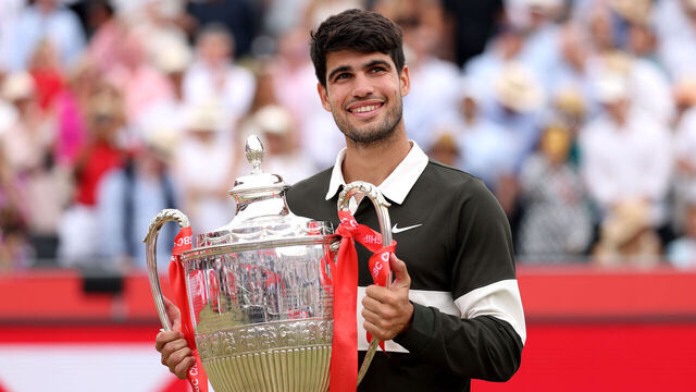 LONDON, ENGLAND - JUNE 22: Carlos Alcaraz of Spain poses for a photo with the HSBC Championships 2025 Winners Trophy following victory over Jiri Lehecka of Czechia in the Men's Singles Final on Day Fourteen of the 2025 HSBC Championships at The Queen's Club on June 22, 2025 in London, England.
