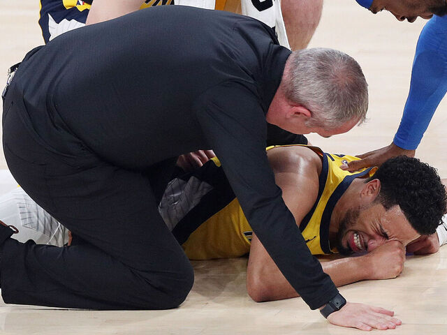 OKLAHOMA CITY, OKLAHOMA - JUNE 22: Tyrese Haliburton #0 of the Indiana Pacers sustains an injury during the first quarter as Shai Gilgeous-Alexander #2 of the Oklahoma City Thunder checks on him in Game Seven of the 2025 NBA Finals at Paycom Center on June 22, 2025 in Oklahoma City, Oklahoma.