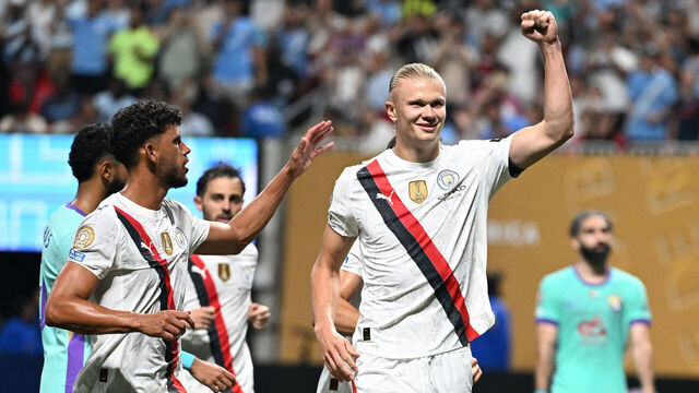 Manchester City's Norwegian striker #09 Erling Haaland (R) celebrates next to teammate Portuguese midfielder #27 Matheus Nunes after scoring his team's third goal during the FIFA Club World Cup 2025 Group G football match between England's Manchester City and UAE's Al Ain FC at the Mercedes-Benz stadium in Atlanta on June 22, 2025.