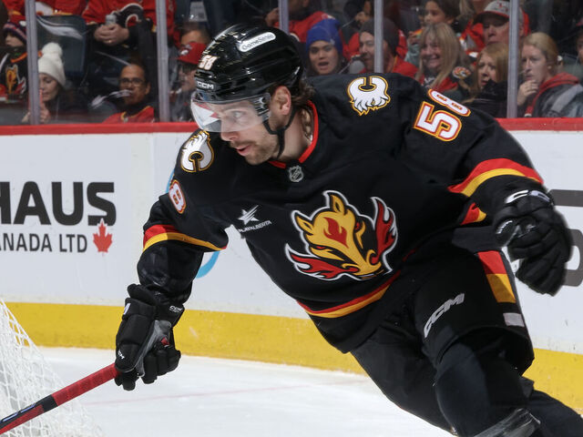 CALGARY, AB - NOVEMBER 23: Justin Kirkland #58 of the Calgary Flames skates against the Minnesota Wild at Scotiabank Saddledome on November 23, 2024 in Calgary, Alberta, Canada.
