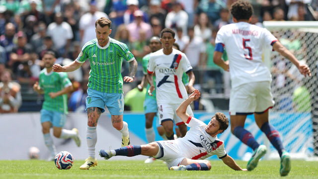 SEATTLE, WASHINGTON - JUNE 23: Albert Rusnak #11 of Seattle Sounders FC is challenged by Joao Neves #87 of Paris Saint-Germain during the FIFA Club World Cup 2025 group B match between Seattle Sounders FC and Paris Saint-Germain FC at Lumen Field on June 23, 2025 in Seattle, Washington.