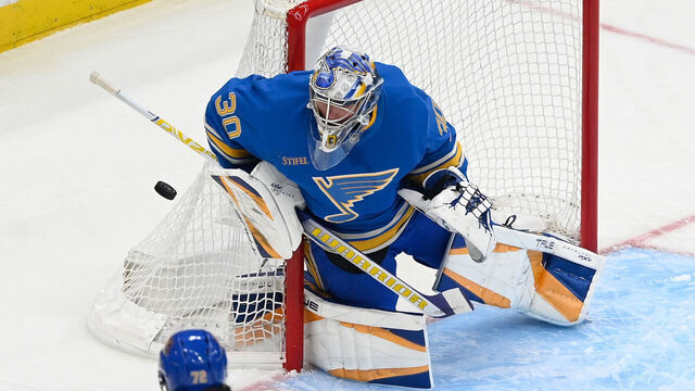 ST. LOUIS, MO - MARCH 22: Joel Hofer #30 of the St. Louis Blues blocks a shot againt the Chicago Blackhawks on March 22, 2025 at the Enterprise Center in St. Louis, Missouri.